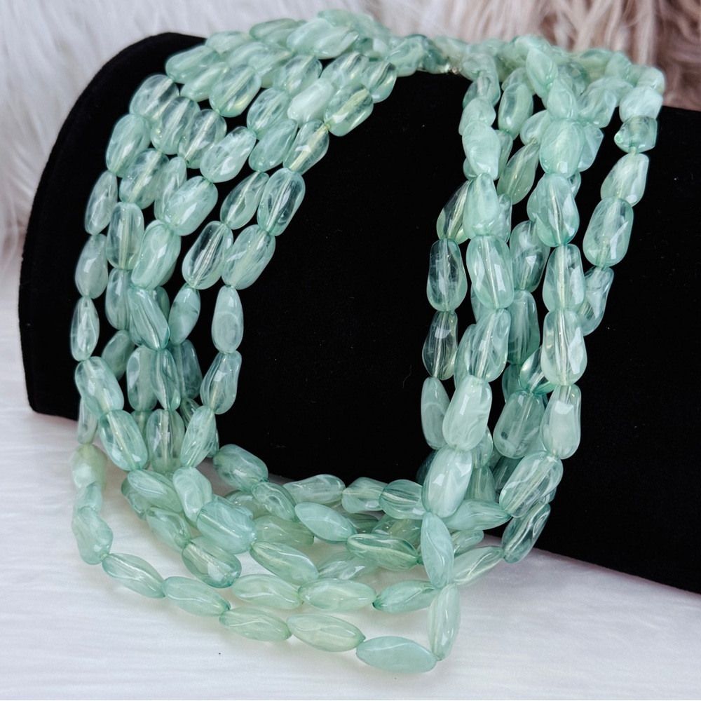 Pretty long, spring light green, three strand necklace